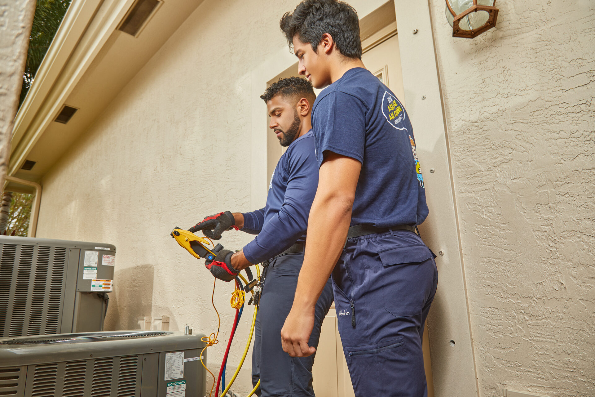 Air We Go techs installing a new AC system